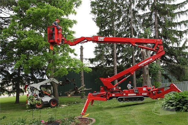 Large aerial lift working in a tree service job in a residential neighborhood